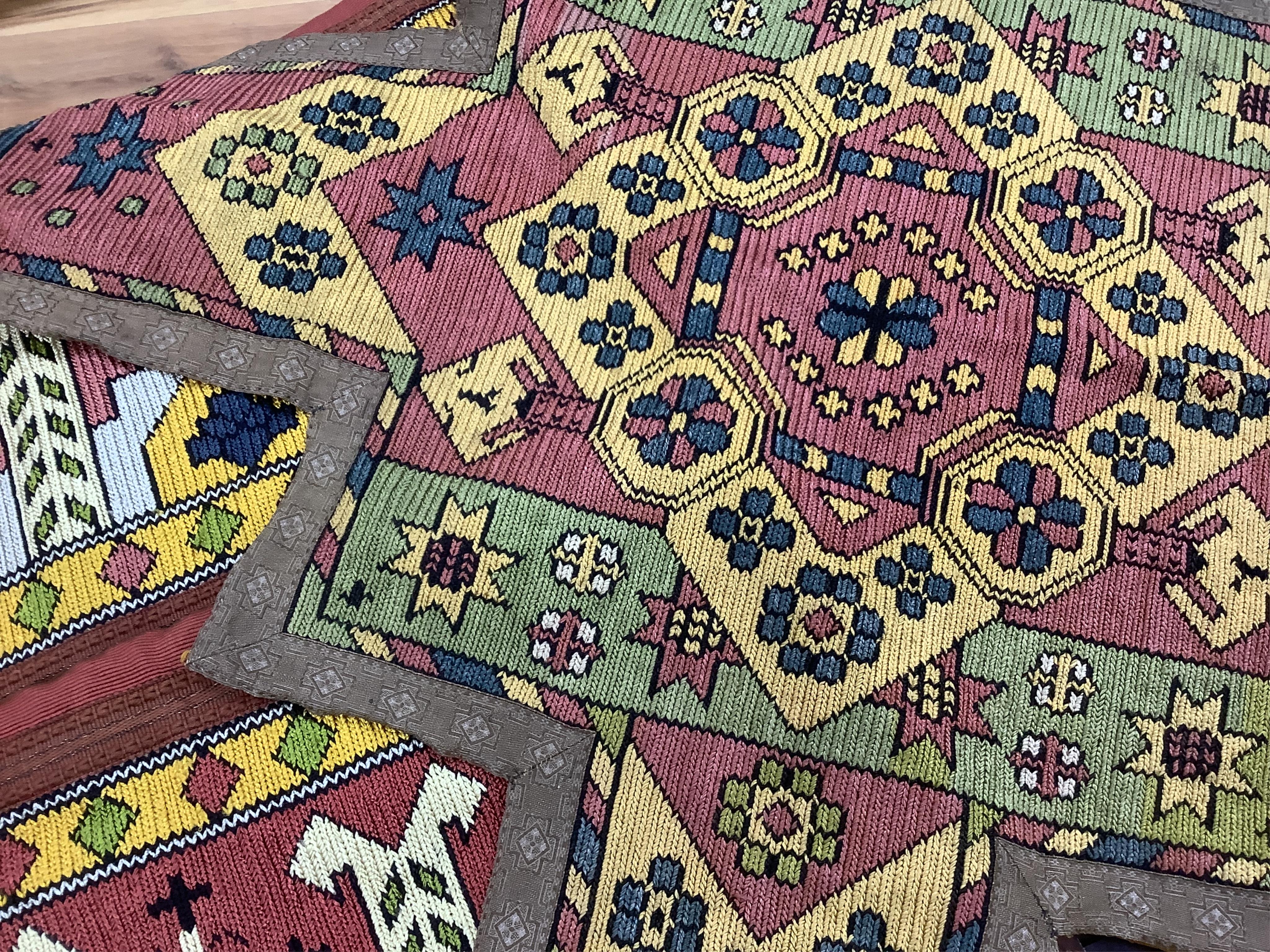 A unusual matching group of 20th century French Ecclesiastical knitted textiles, with Caucasian design elements. Hand embroidered with coloured silks in a bold geometric design, bordered with gold braiding and tasselling